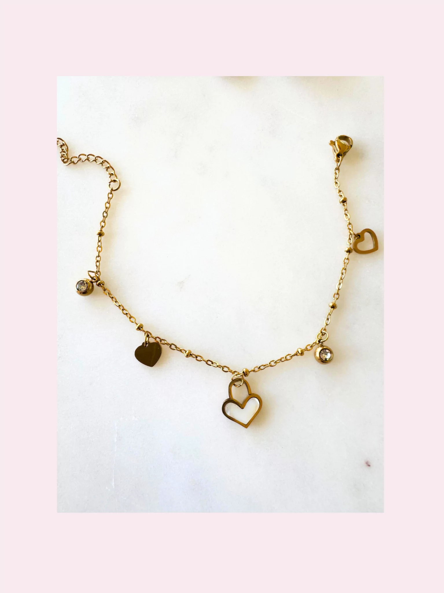 bracelet waterproof. Premium stainless steel Bracelet with charms with 18krt gold layer. Non-tarnish.